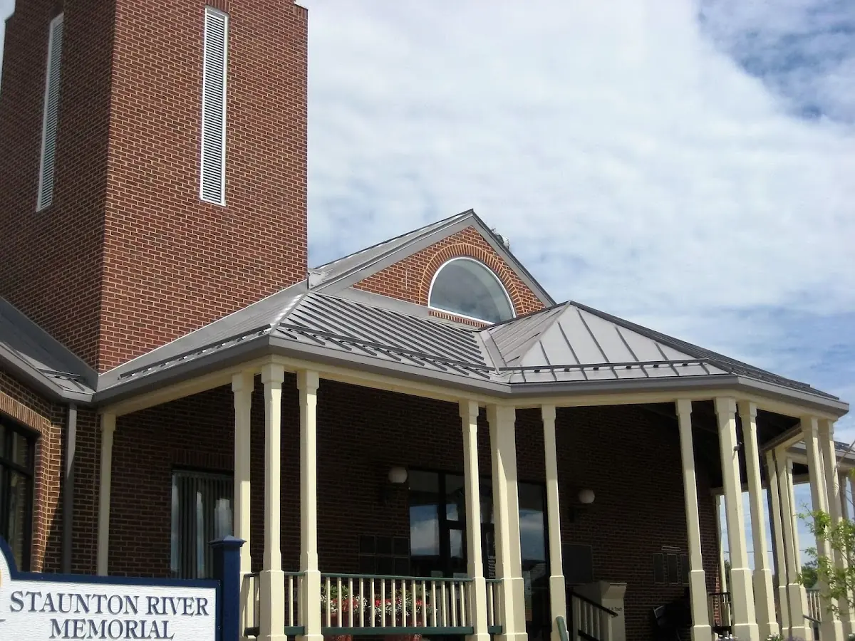 Skilled roofing craftsmen working on a residential roof in Hamden